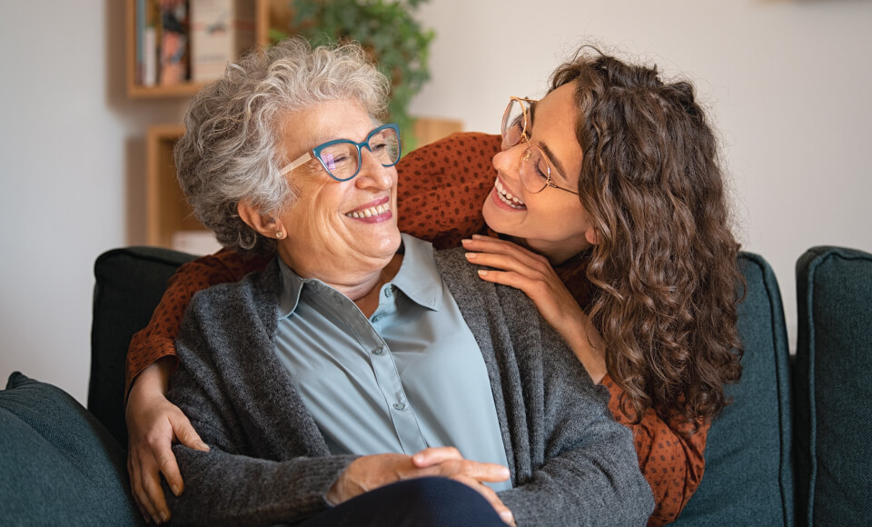 senior laughing with team member