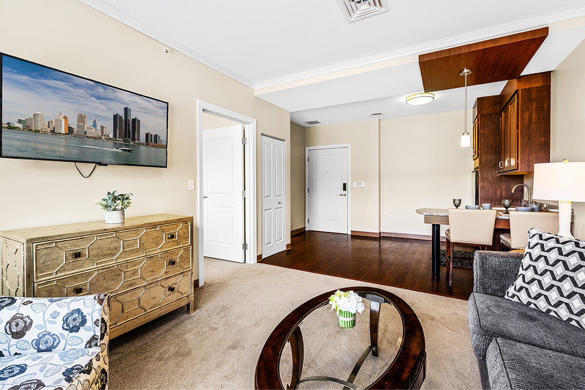 Avalon_Bloomfield_B-44 model apartment living room and view of kitchen
